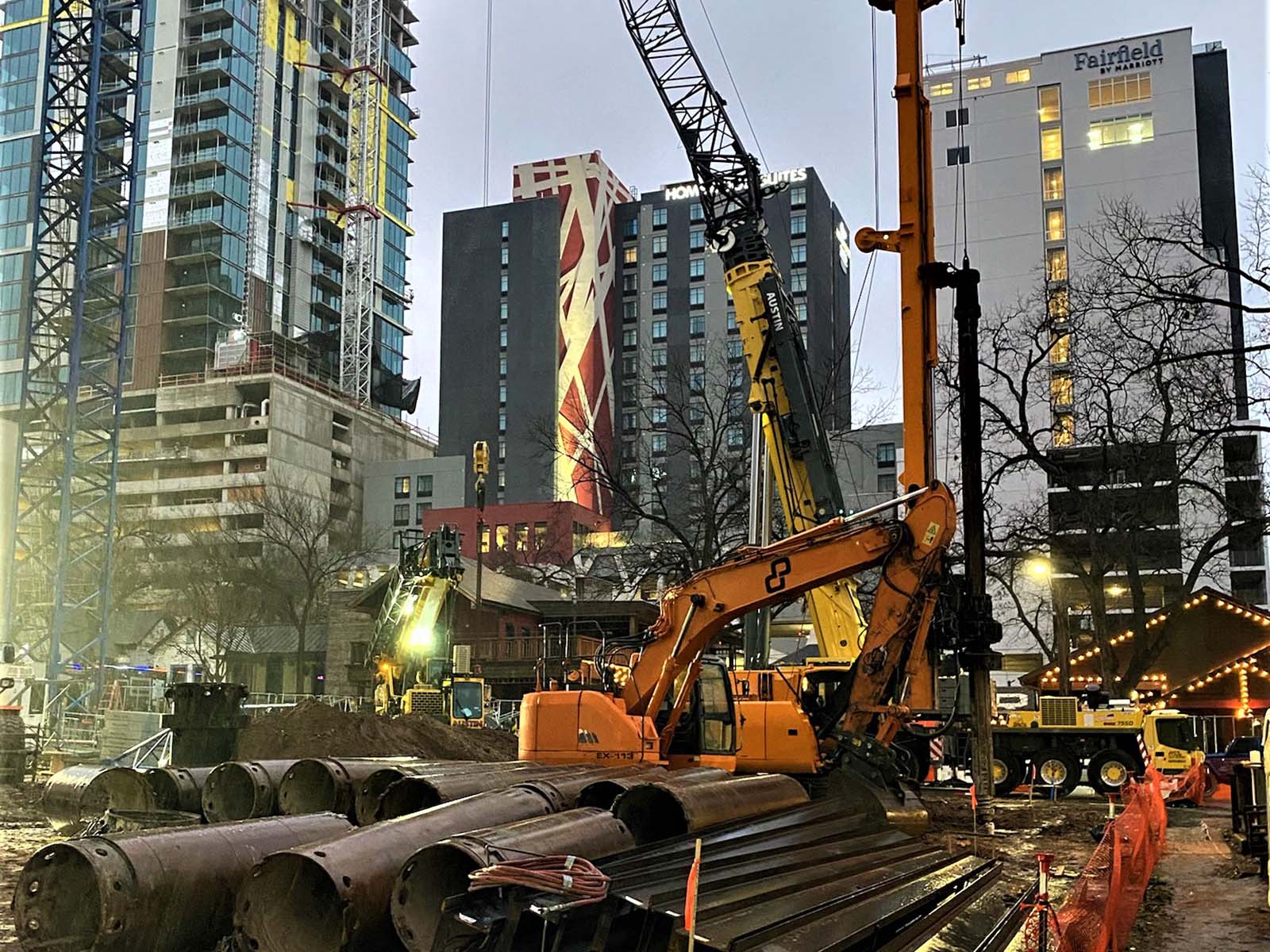 Deep excavation at Paseo 80 Rainey in Austin, Texas, featuring Anchored Soldier Piles and Tieback Anchors by Oscar Orduno, Inc.