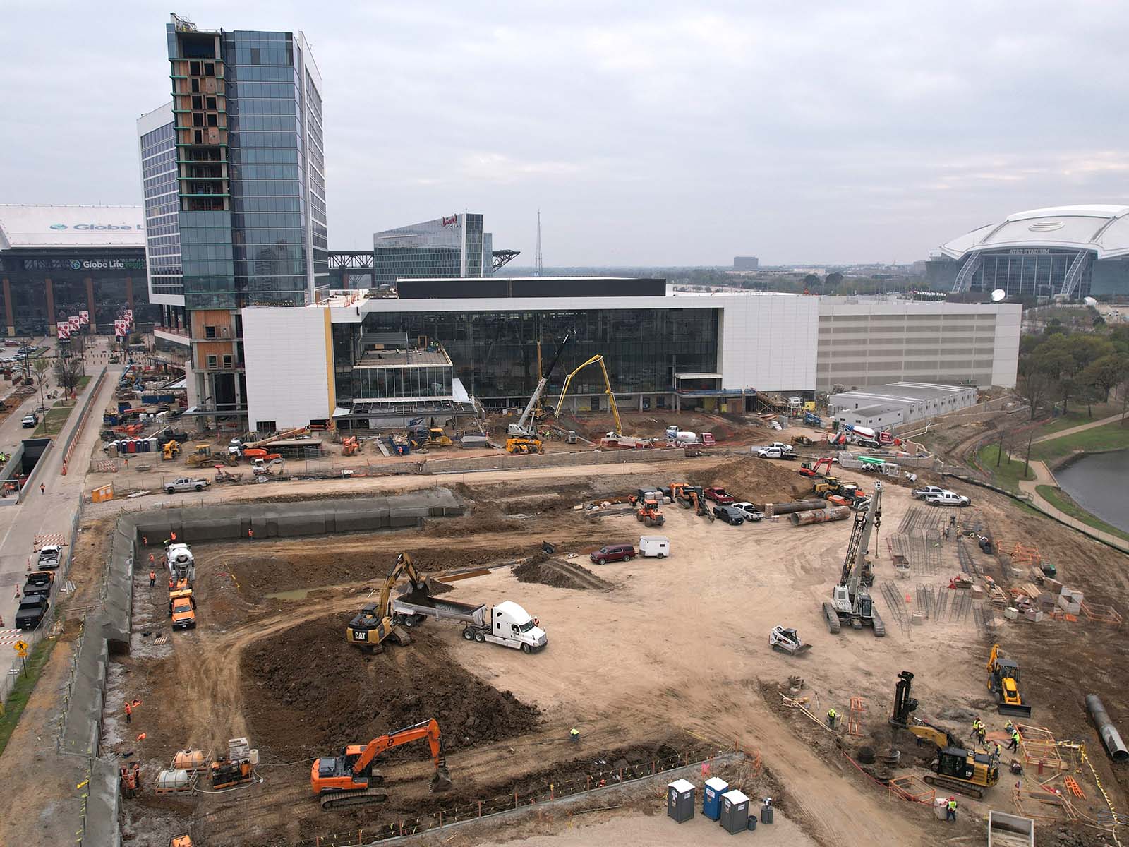 Deep excavation at One Rangers Way in Arlington, Texas, featuring Anchored Soldier Piles with Tieback Anchors and Soil Nail Anchors by Oscar Orduno, Inc.