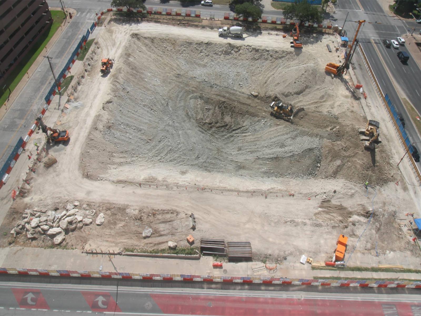 Aerial view of the deep Capitol Complex Phase II excavation in Austin, Texas, featuring earth retention systems by Oscar Orduno, Inc.