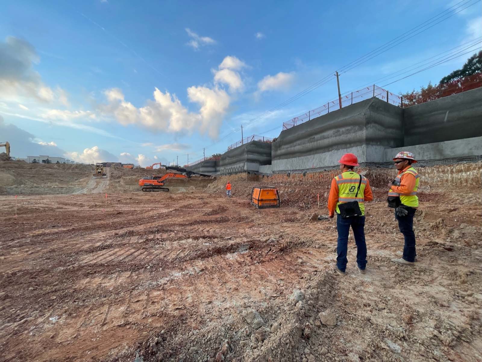 Oscar Orduno, Inc. field team overseeing active site grading and multi-tiered shotcrete earth retention walls The Ismaili Center in Houston TX