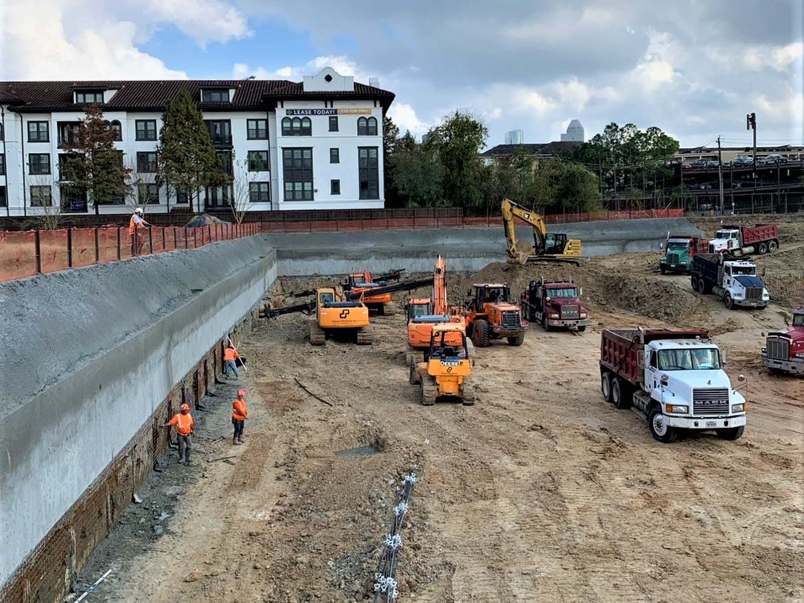 Large-scale excavation featuring soil nail wall stabilization and heavy equipment coordination for The Ismaili Center in Houston TX by Oscar Orduno, Inc.