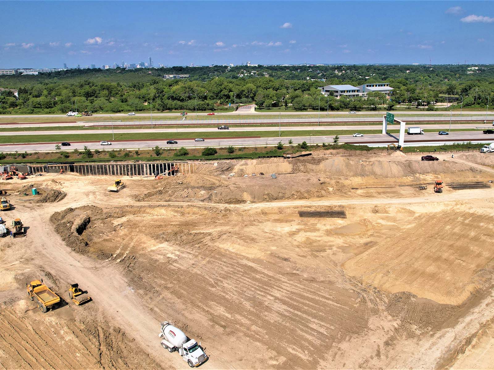 Deep excavation in Austin, TX featuring a drilled shaft wall and earth retention systems installed by Oscar Orduno, Inc. near major transit corridors.