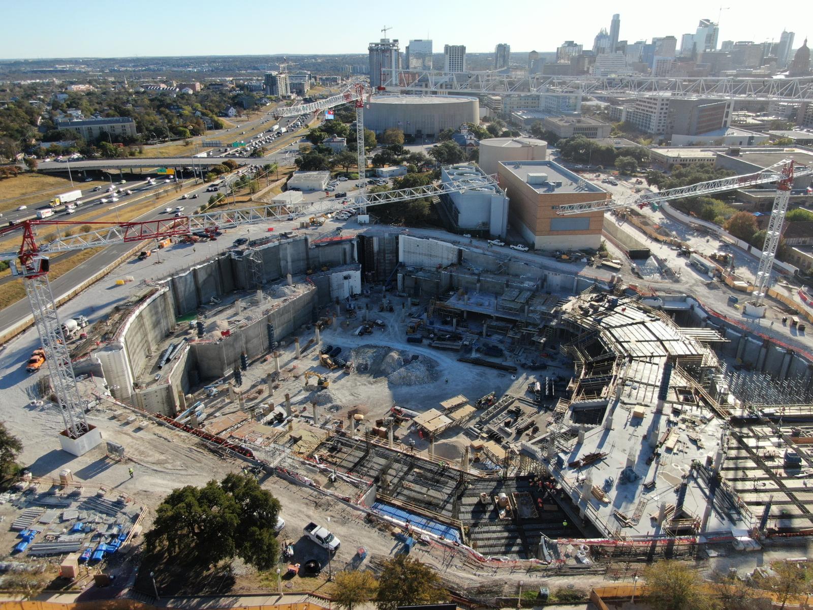 Deep excavation at UT Moody Center featuring Anchored Soldier Pile Wall and Soil Nail Anchors by Oscar Orduno, Inc. in Austin, TX.